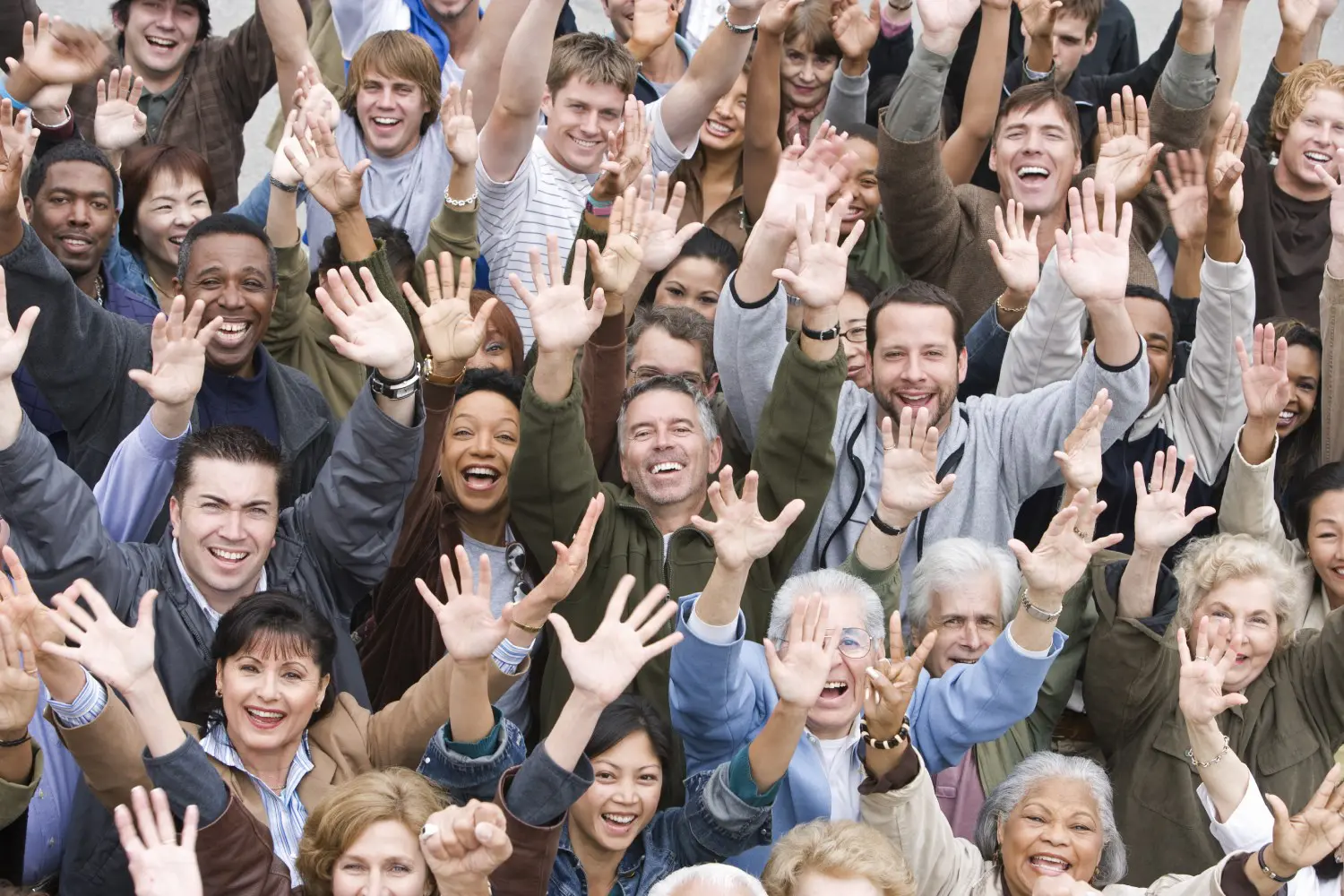 A group of people with their hands up