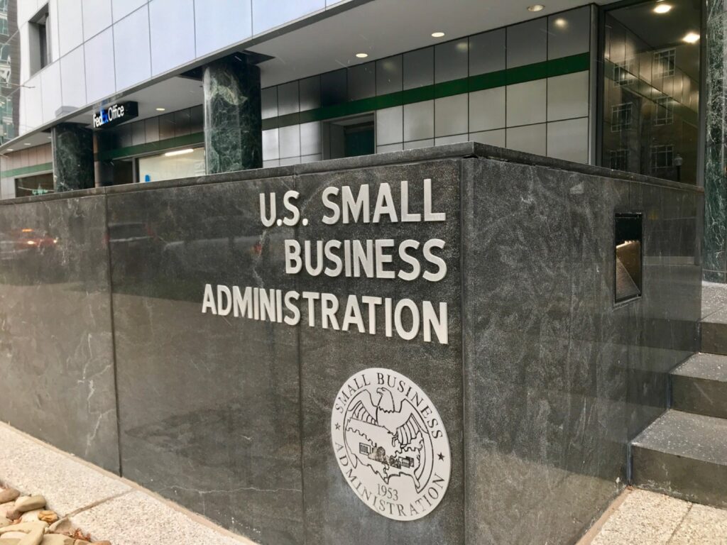 A small business administration building with the seal of the u. S. Small business administration on it's side